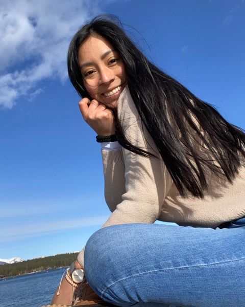 Heisil, smiling by a lake